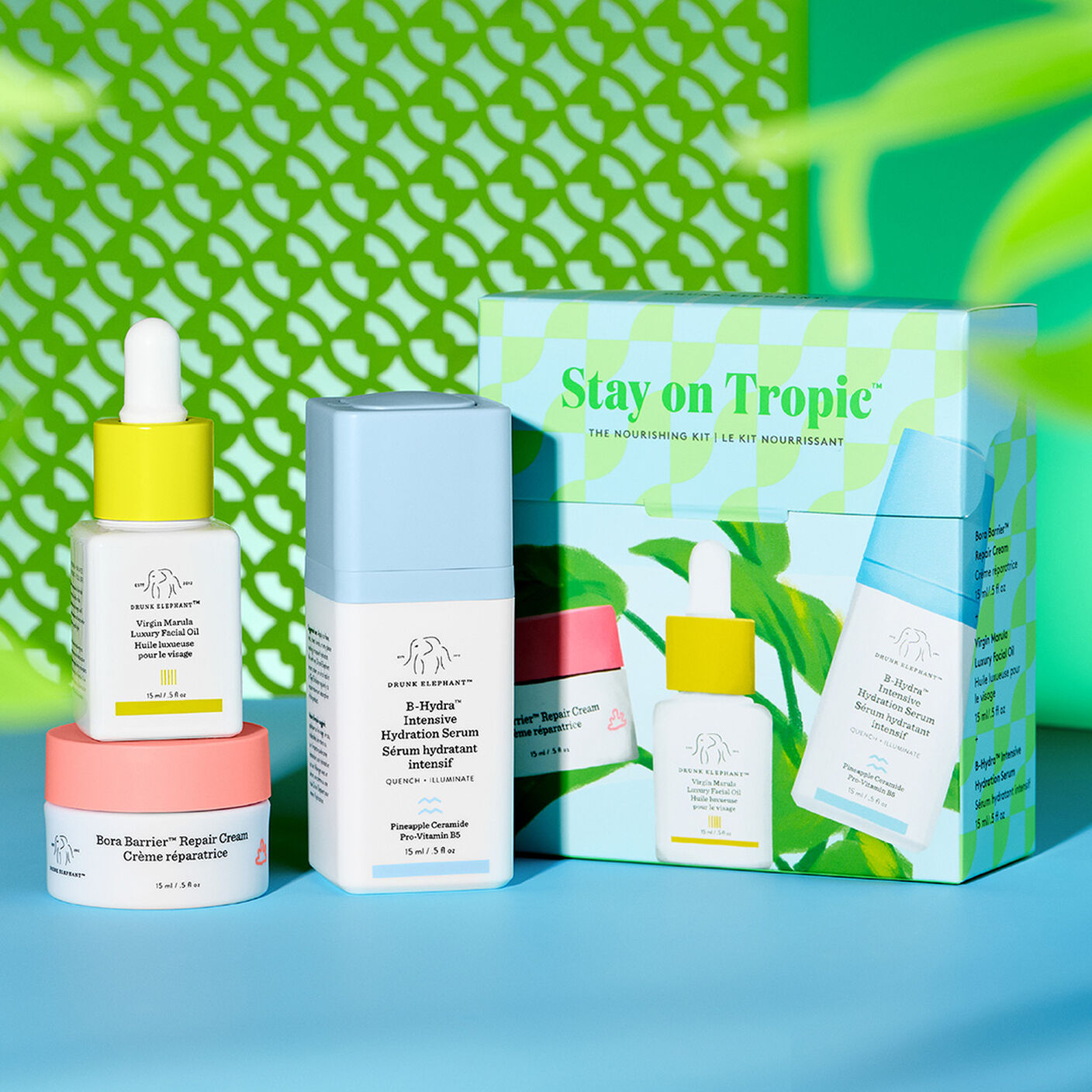 Bora Barrier, B-Hydra and Virgin Marula Oil standing in front of kit packaging with a graphic green background