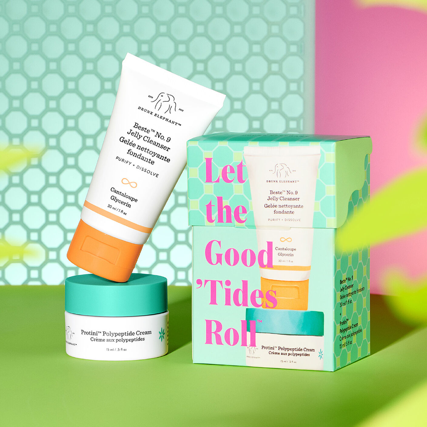 Beste No. 9 and Protini Cream standing on top of each other next to kit packaging with graphic green and pink background